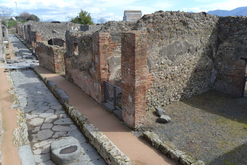Via degli Augustali, Pompeii. March 2018.
Looking east from near VII.1.37, on right, towards the junction with Via Stabiana, and continuation eastwards towards IX.3/IX.2 and IX.6/IX.7.
Foto Taylor Lauritsen, ERC Grant 681269 DÉCOR.
