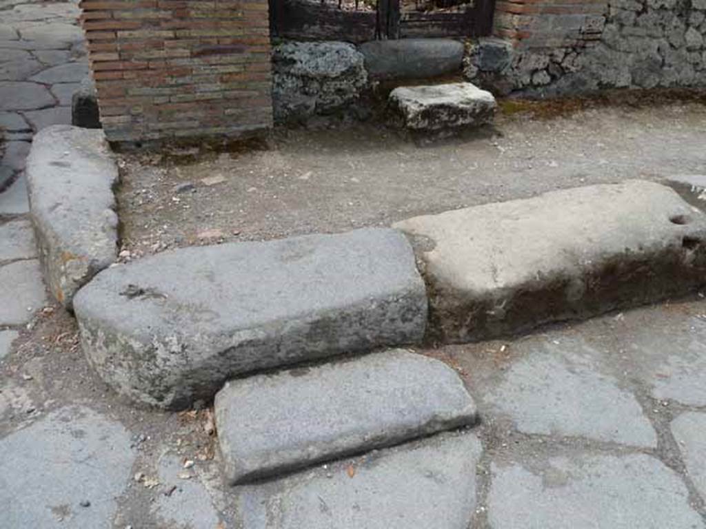 Via dei Teatri, west side, May 2010. Step in road, near entrance to VIII.5.36.