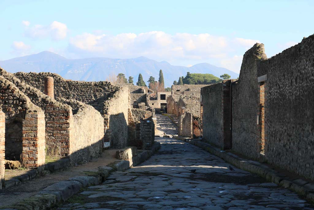 Via del Tempio d’Iside, Pompeii. December 2018.
Looking east between VIII.4, on left, and VIII.7, on right, towards junction with Via Stabiana, and across into Vicolo del Menander.
Photo courtesy of Aude Durand.
