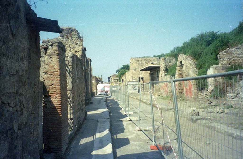 Via dell’Abbondanza. July 2011. Looking west between II.2 and III.5, from near II.3.1/2, on left. Photo courtesy of Rick Bauer.