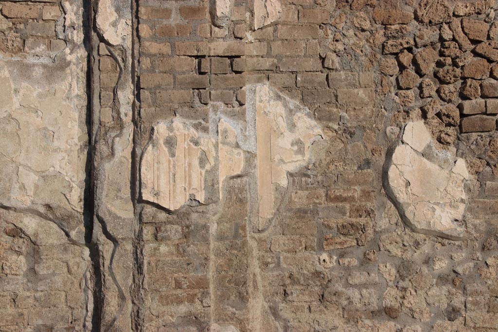 Via dell’Abbondanza, Pompeii. October 2022.
Detail from exterior upper south wall of Building of Eumachia on north side of Via dell’Abbondanza. Photo courtesy of Klaus Heese.