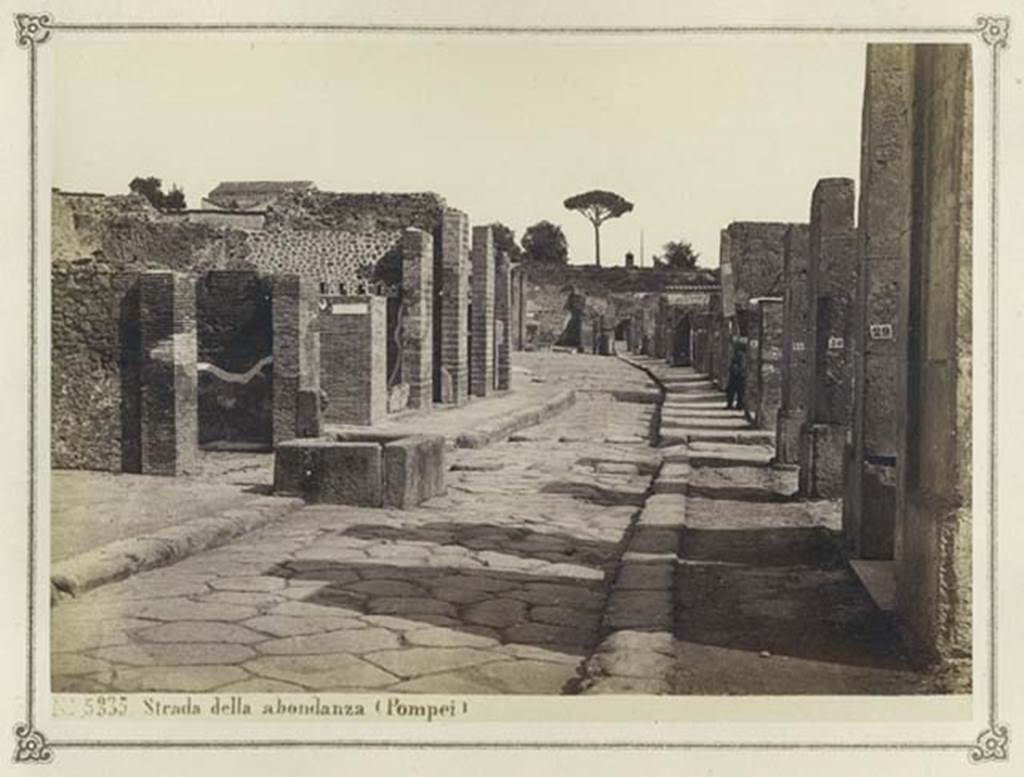 Via dell’Abbondanza. From an album dated February 1874. Looking east from near fountain at VII.14.13/14.
In the distance is the “as-yet-unexcavated” area near Holconius crossroads. Photo courtesy of Rick Bauer.