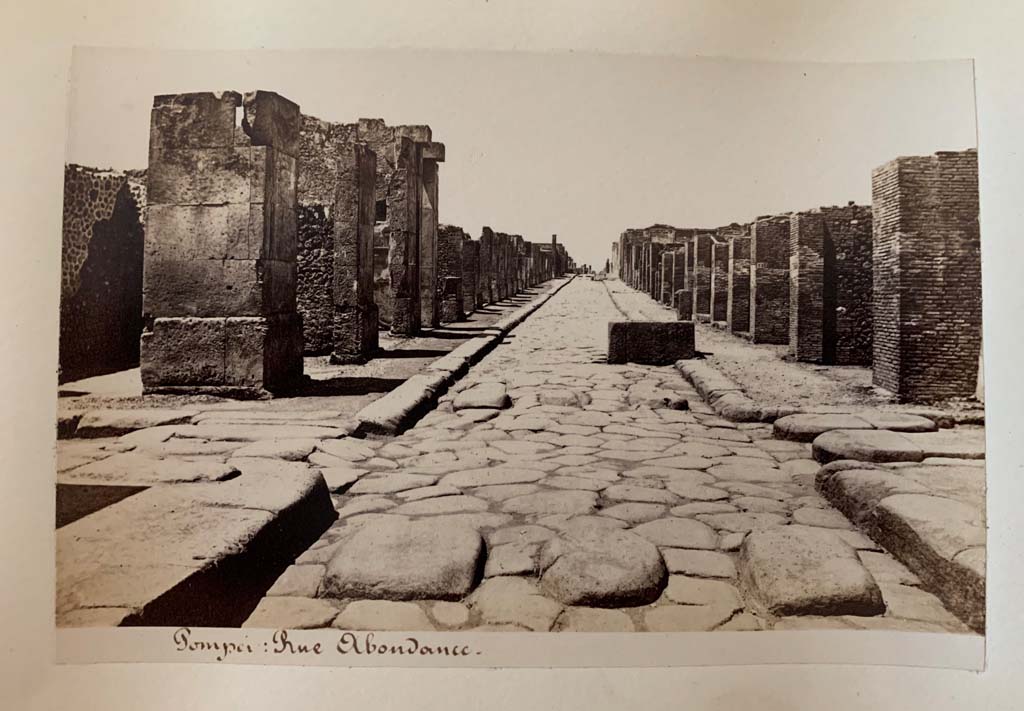 Via dell’Abbondanza. Album by M. Amodio, c.1880, entitled “Pompei, destroyed on 23 November 79, discovered in 1748”.
Looking west to crossroads with Via dei Teatri, on left, and Vicolo del Lupanare, on right.
Photo courtesy of Rick Bauer.