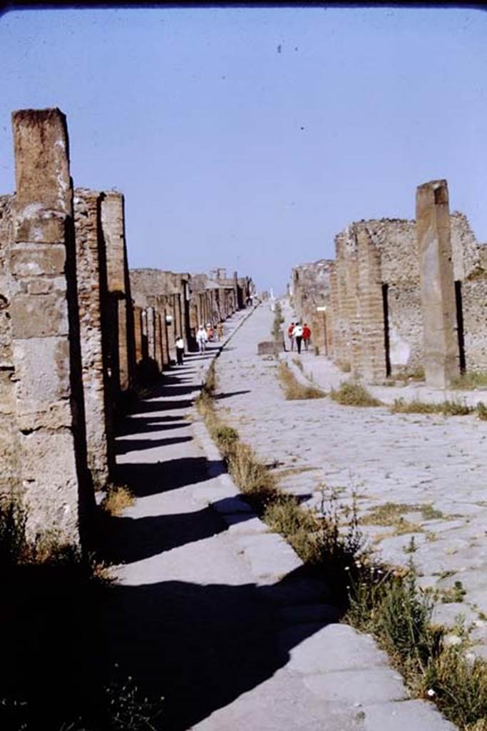 Via dell’ Abbondanza, Pompeii. 1968. Looking west towards Forum, from between VIII.4 and VII.1. Photo by Stanley A. Jashemski.
Source: The Wilhelmina and Stanley A. Jashemski archive in the University of Maryland Library, Special Collections (See collection page) and made available under the Creative Commons Attribution-Non Commercial License v.4. See Licence and use details.
J68f1053