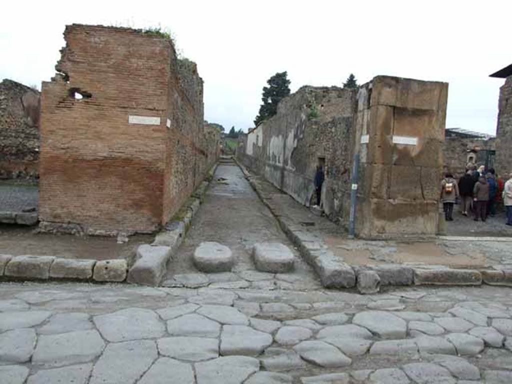 Via della Fortuna, north side, May 2010. Junction with Vicolo del Fauno, between VI.10 and VI.12.