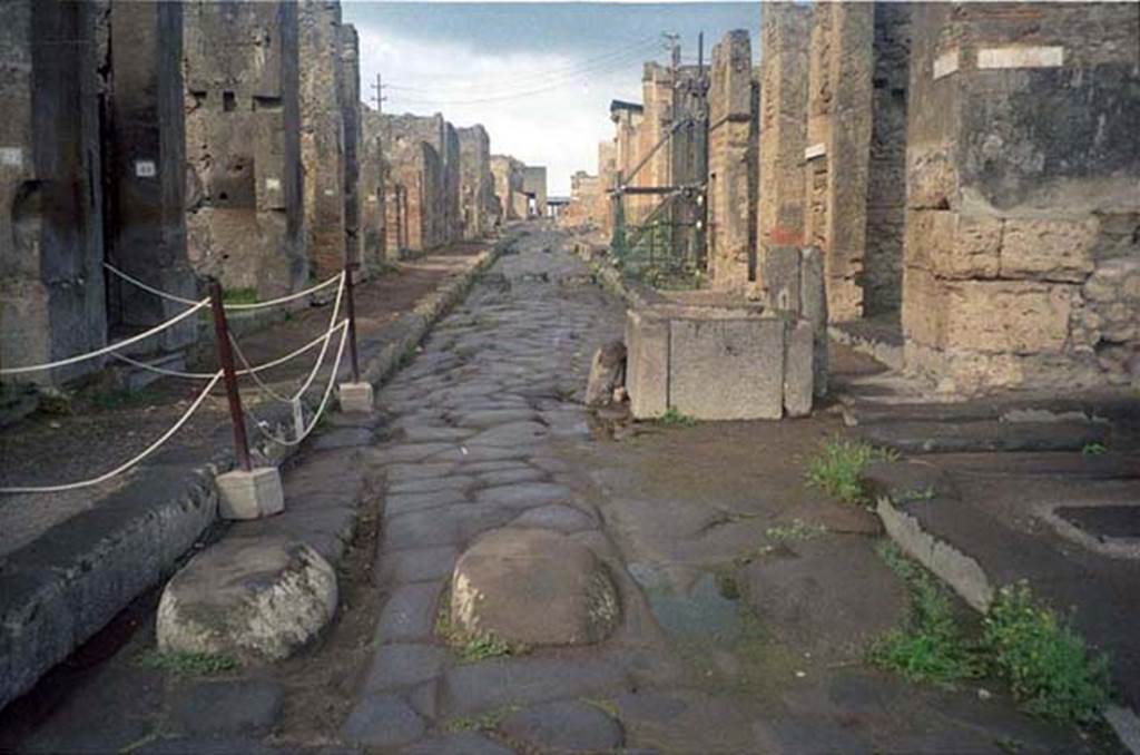 Via della Fortuna. July 2011. Looking west between VII.4 and VI.13.
Photo courtesy of Rick Bauer.