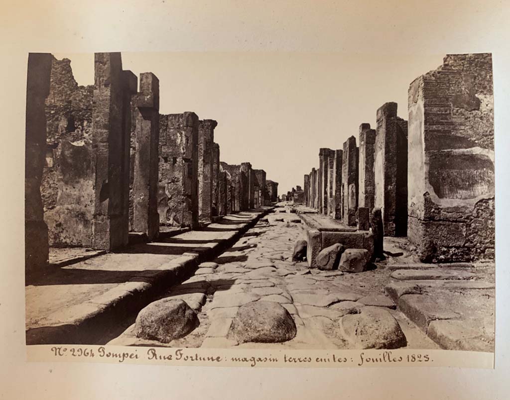 Via della Fortuna, Pompeii. Photograph by M. Amodio, from an album dated April 1878.
Looking west towards fountain between VII.4 and VI.13, and junction with Vicolo dei Vettii, on the right.
Photo courtesy of Rick Bauer.