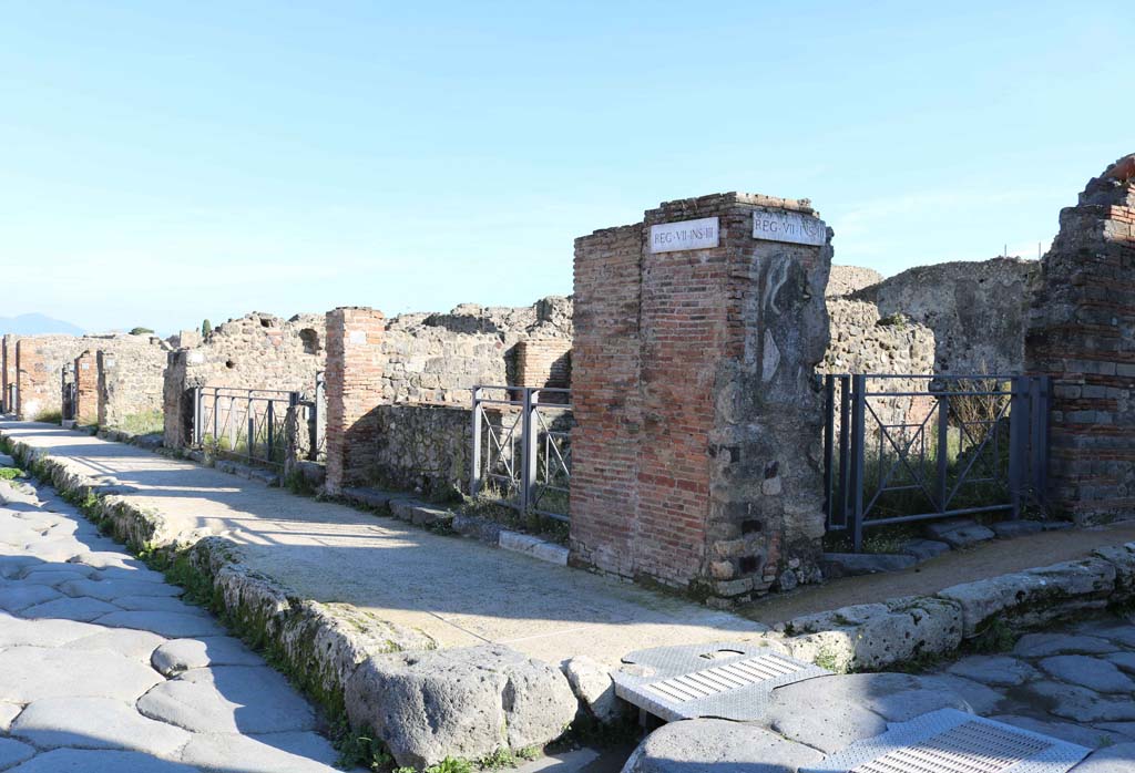 Via della Fortuna, south side, on left, Pompeii. December 2018.
Looking south-east from junction with Vicolo Storto, on right, and along VII.3. Photo courtesy of Aude Durand.