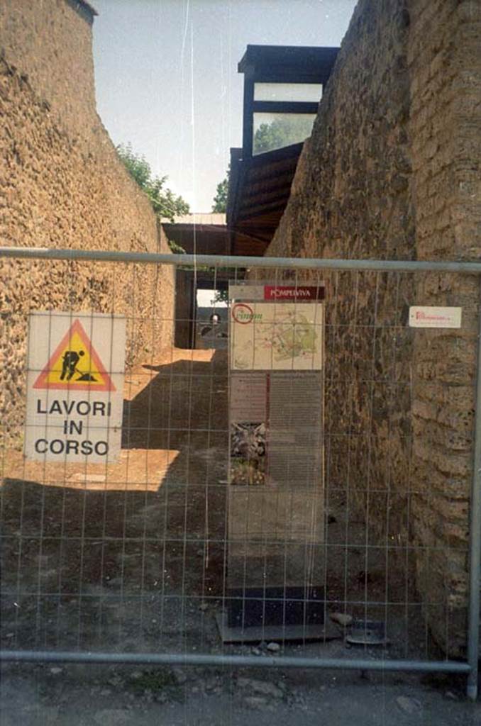 Via della Palestra between II.9 and II.8. July 2011.
Looking east, road closed while work is in progress. Photo courtesy of Rick Bauer.