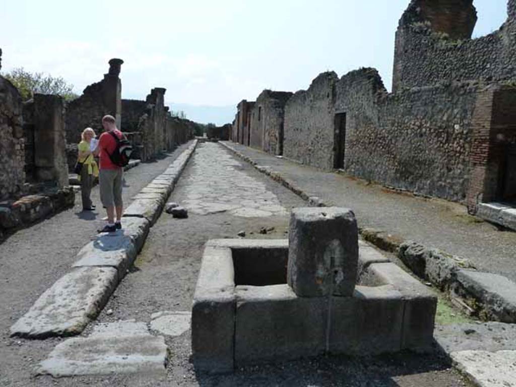 Via delle Scuole. May 2010. Looking south between VIII.3 and VIII.2, from the Forum.