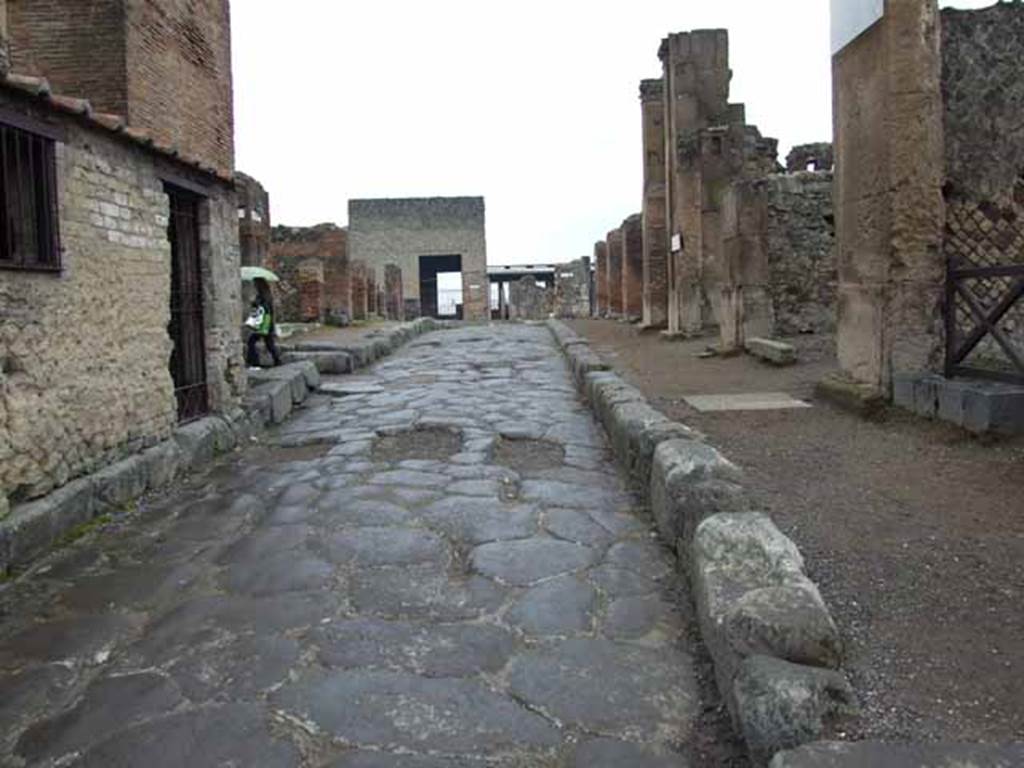 Via delle Terme. May 2010. Looking west between VII.5 and VI.6.