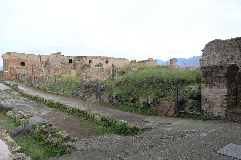 Via delle Terme, south side, Pompeii. December 2018.
Looking east from junction with Vicolo del Farmacista, on right, from VII.6.1 towards VII.6.15. Photo courtesy of Aude Durand.