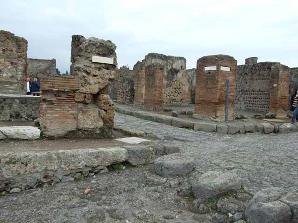 Via delle Terme, north side. May 2010. Looking north to junction with Via Consolare, between VI.4 and VI.6.