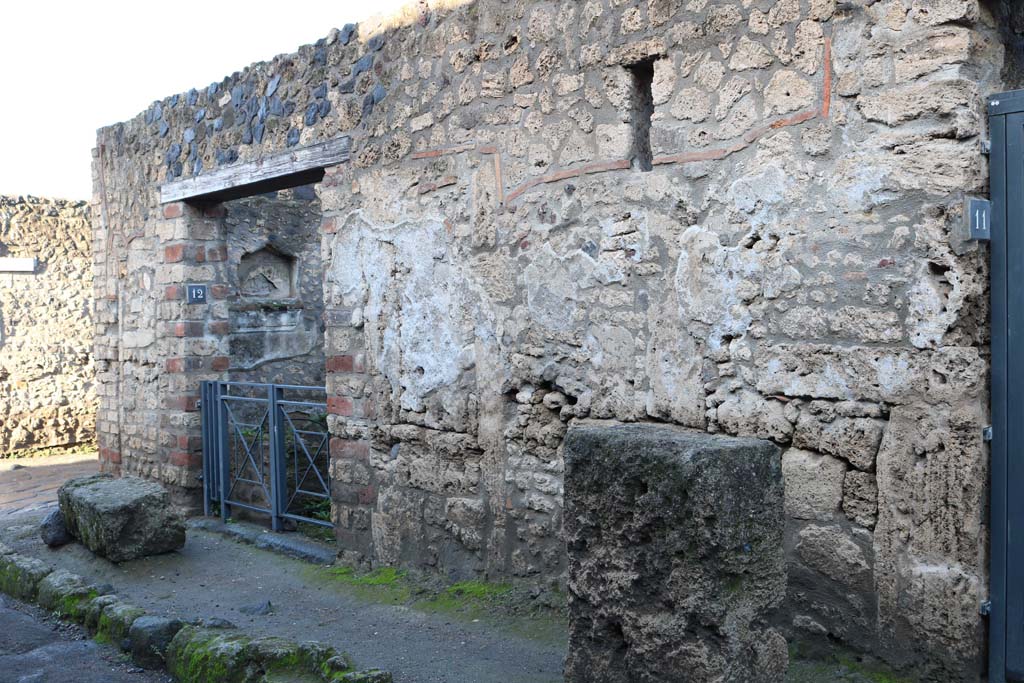 Via di Castricio, north side, Pompeii. December 2018.
Entrance doorway of I.12.12 on east side of junction with Vicolo della Nave Europa, on left. Photo courtesy of Aude Durand.