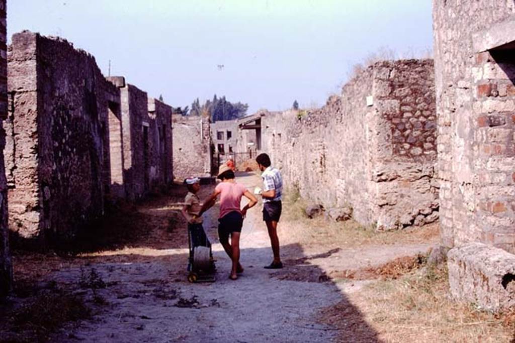 Via di Castriccio, Pompeii. 1974. Looking west between I.16 and I.11 from near junction with Via della Nave Europa, on left and right. Photo by Stanley A. Jashemski.
Source: The Wilhelmina and Stanley A. Jashemski archive in the University of Maryland Library, Special Collections (See collection page) and made available under the Creative Commons Attribution-Non Commercial License v.4. See Licence and use details. J74f0489