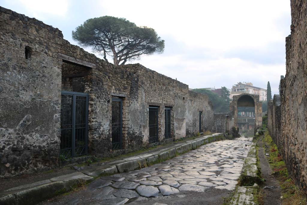 Via di Nocera, east side, Pompeii, December 2018.
Looking south from near II.8.5, on left, towards Porta di Nocera, with I.20, on right. Photo courtesy of Aude Durand.