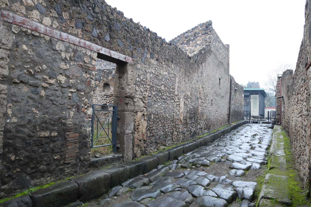 Via di Nocera, west side, December 2018.
Looking north towards junction with Via dell’Abbondanza, from near I.13.6. Photo courtesy of Aude Durand.