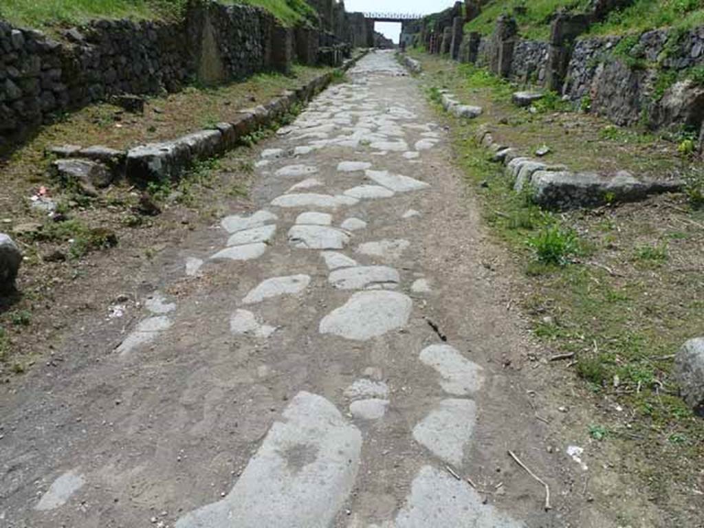 Via di Nola, May 2010. Looking west between III.9 and IV.3, from junction with unexcavated, unnamed vicoli to both north and south.