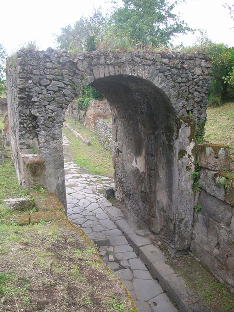 Via di Nola, Pompeii. May 2010.
Looking west through Nola Gate towards roadway. Photo courtesy of Ivo van der Graaff.