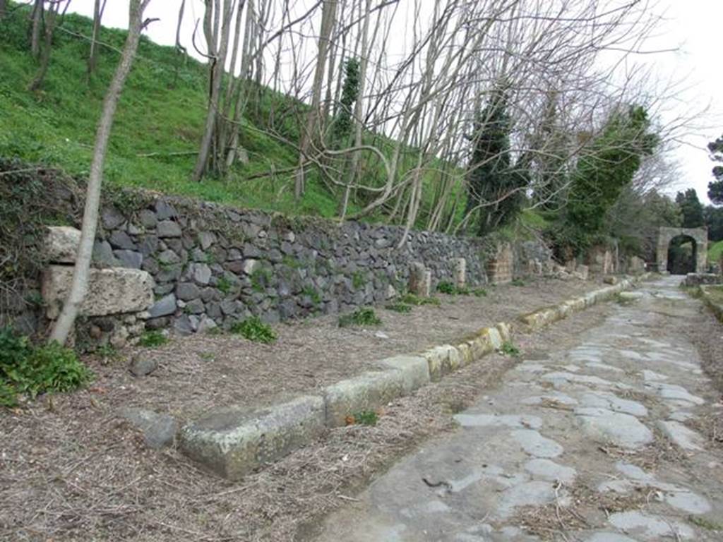 Via di Nola, north side. March 2009. Looking east along IV.4. from the junction with unnamed vicolo.