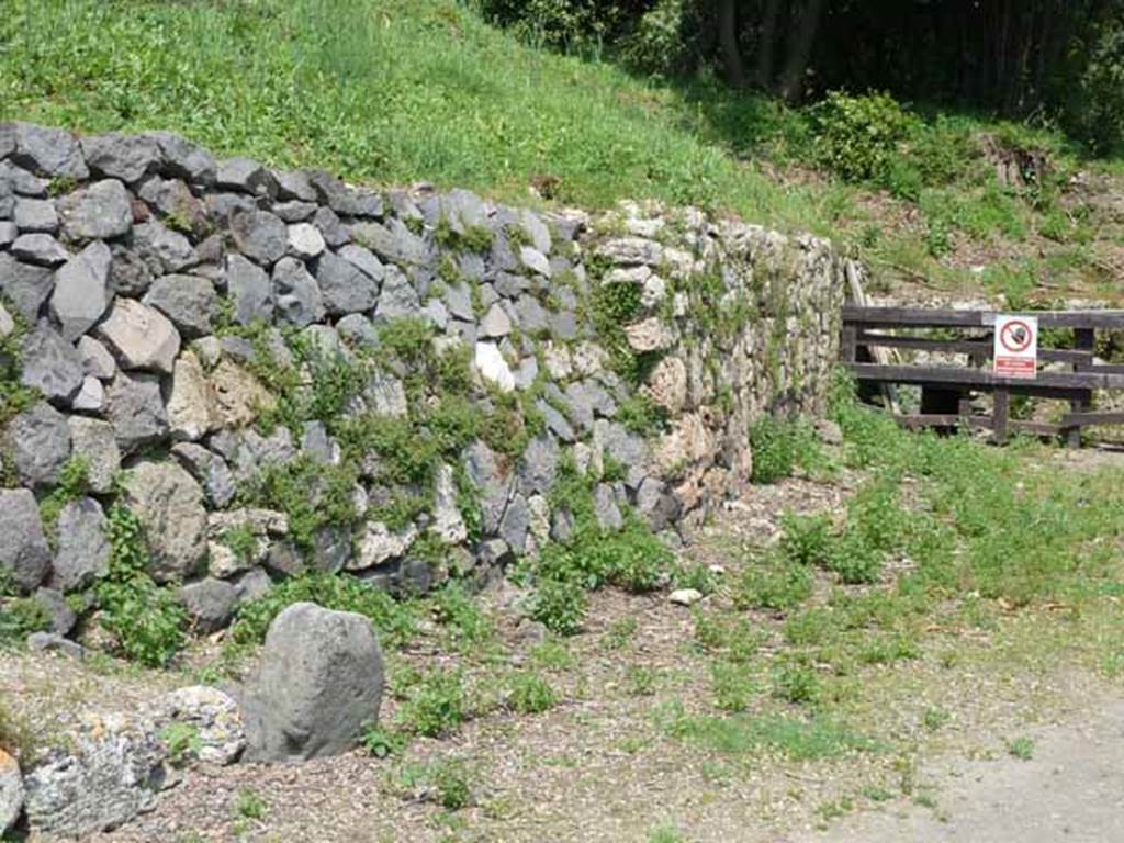 Via di Nola, north side, May 2010. East side of IV.5, boundary marker and site of road.