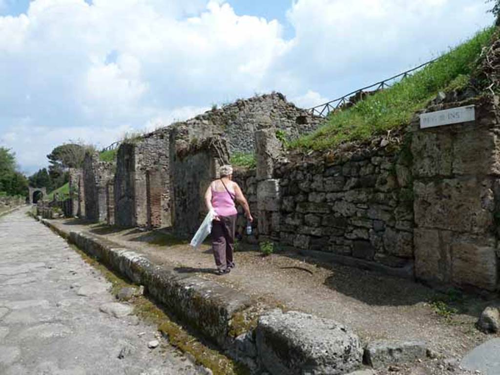 Via di Nola, south side, May 2010. Looking east along III.8, from near III.8.1 and junction with unexcavated unnamed vicolo.