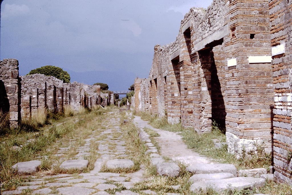 Via di Nola, Pompeii. 1964.
Looking east between V.2 and IX.5, from junction with Vico di Tesmo, on right. Photo by Stanley A. Jashemski.
Source: The Wilhelmina and Stanley A. Jashemski archive in the University of Maryland Library, Special Collections (See collection page) and made available under the Creative Commons Attribution-Non Commercial License v.4. See Licence and use details.
J64f1370