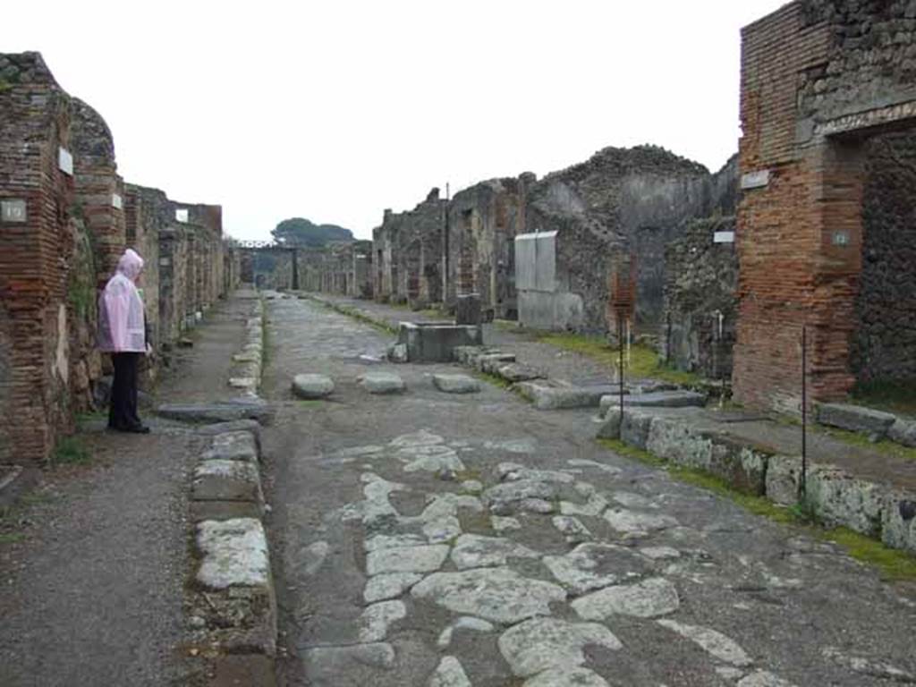 Via di Nola, May 2010. Looking east between V.2 and IX.5, to the junction with an unnamed vicolo on the left, and Vicolo del Centenario, on the right.