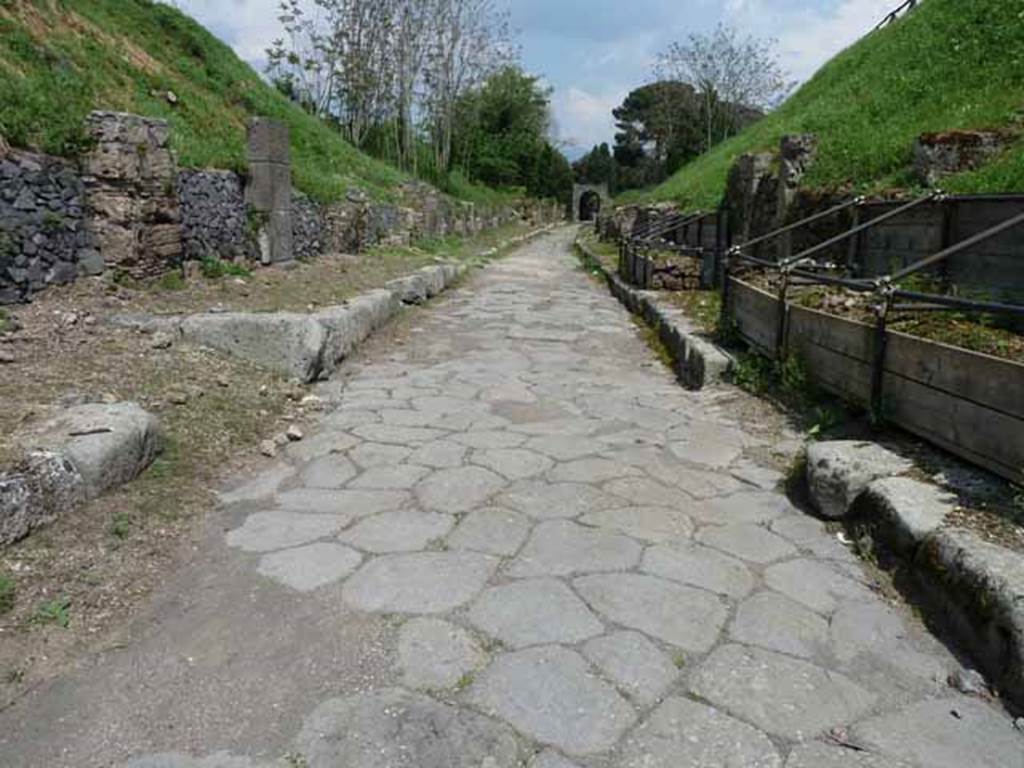 Via di Nola, May 2010. Looking east between IV.3 and III.9, from junction with unexcavated vicoli to both north and south.
