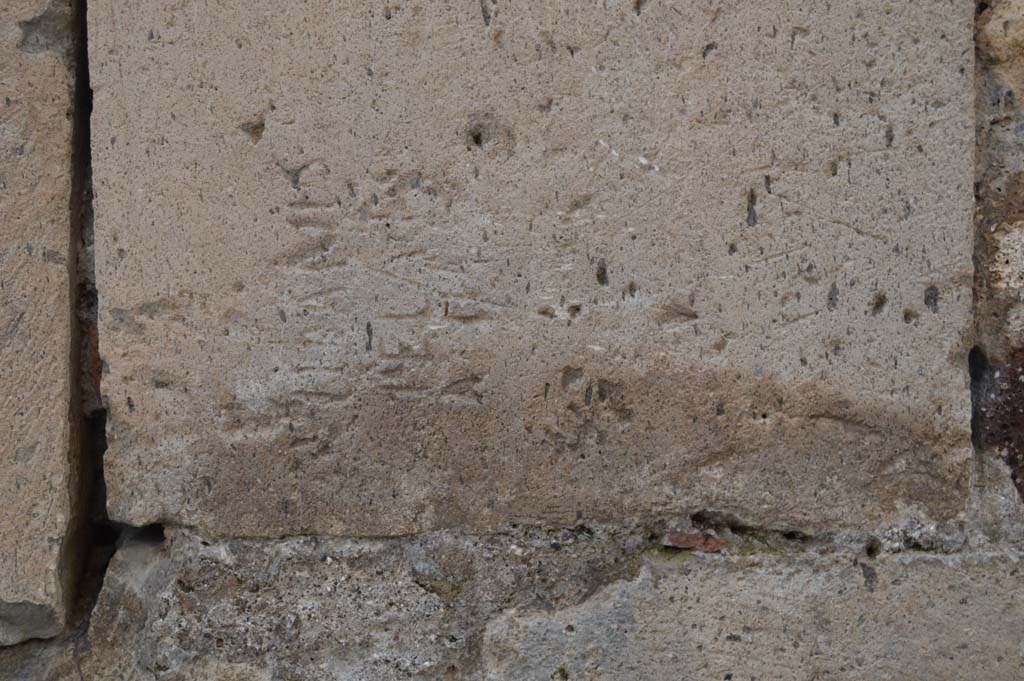 Vicolo degli Scheletri, Pompeii. March 2018.
Looking south to detail of inscribed stonework on corner of VII.13, at junction with Vicolo della Maschera.
Foto Taylor Lauritsen, ERC Grant 681269 DÉCOR.