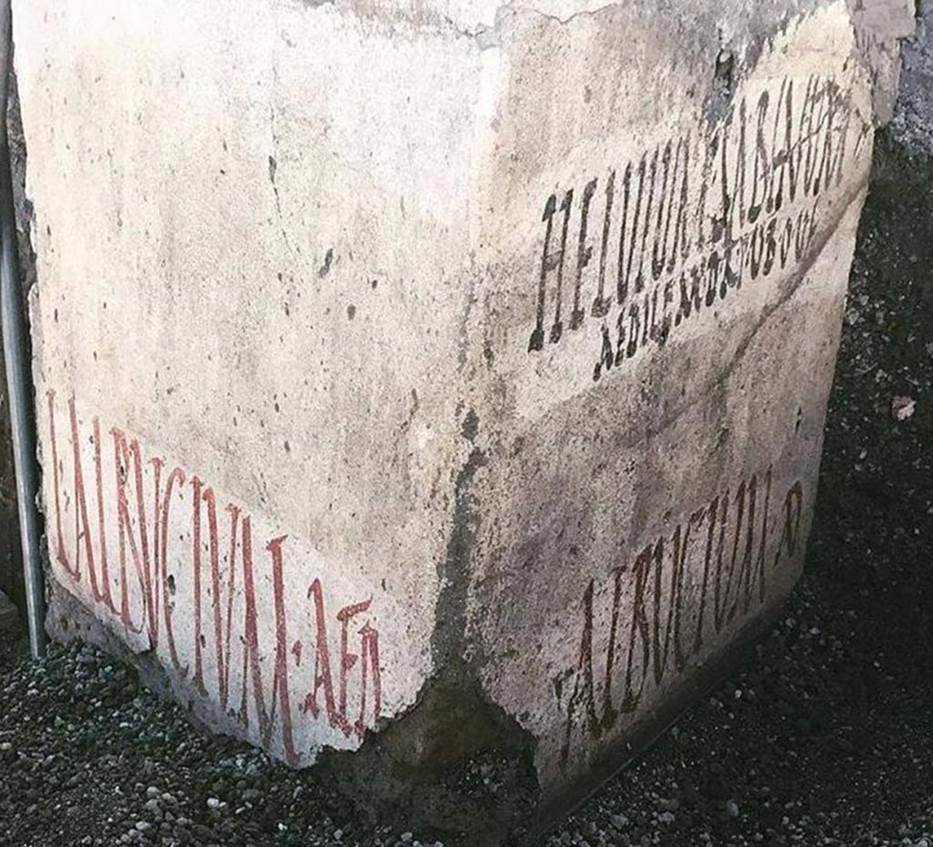 Vicolo delle Nozze Argento, at junction with Vicolo dei Balconi. Three electoral inscriptions at north-west corner of junction.
On the East wall are two inscriptions:
In black above is the inscription
HELVIUM SABINUM
AEDILEM D R P V B O V F
Helvium Sabinum
aedilem d(ignum) r(ei) p(ublicae)
v(irum) b(onum) o(ro) v(os)
f(aciatis)
In red below is the inscription:
ALBVCIVM AED
Electoral inscription on the south wall:
L ALBVCIVM AED
L(ucium) Albucium aed(ilem).
The Albucii were probably the owners of the House of the Silver Wedding.
The inscriptions were made on a layer of white paint, perhaps done to cover previous inscriptions and in any case to ensure a clear writing surface for the preserved inscriptions, which refer to the last electoral campaign of Pompeii before 79AD.
Photograph © Parco Archeologico di Pompei.