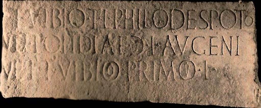FPStreet Pompeii. Plaque of Titus Vibius Philodespotus T. L., Popidia Augeni G. L., and Titus Vibius Primus.
This had the inscription
T VIBIO T L PHILODESPOTO
ET POPIDIAE G L AVGENI
ET T VIBIO PRIMO L
According to D’Ambrosio and De Caro, this expands to
T(ito) Vibio T(iti) l(iberto), Philodespoto
et Popidiae G(aiae) l(ibertae) Augeni
et T(ito) Vibio Primo l(iberto)
See D’Ambrosio A. and De Caro S., 1988. Römische Gräberstraßen. München: C.H.Beck. p. 277, Taf 39e.