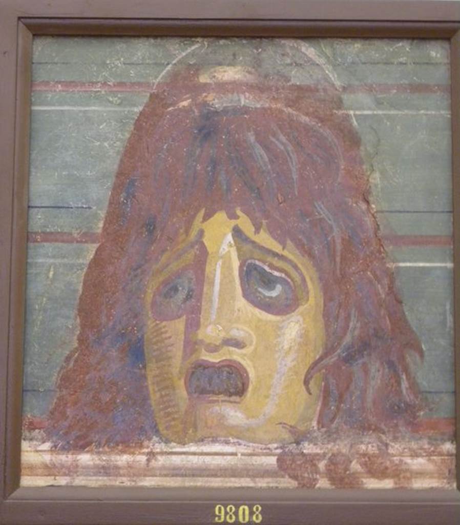 HGW04 Pompeii. Schola Tomb of Mamia, wall painting of mask. Found 2nd July 1763 on the north wall of the enclosure separating HGW04 from HGW04a. Now in Naples Archaeological Museum. Inventory number 9808. See Pagano, M. and Prisciandaro, R., 2006. Studio sulle provenienze degli oggetti rinvenuti negli scavi borbonici del regno di Napoli. Naples : Nicola Longobardi. (p. 44).
