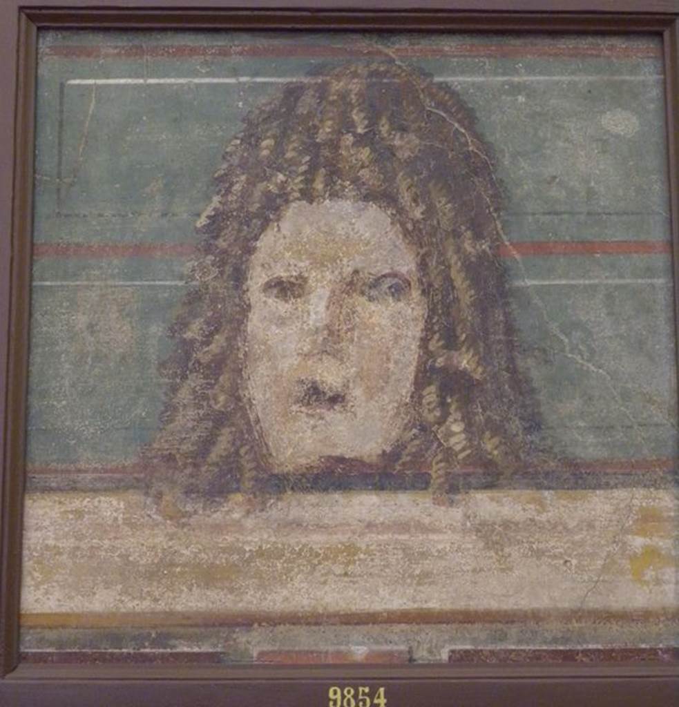 HGW04 Pompeii. Schola Tomb of Mamia, wall painting of mask. Found 2nd July 1763 on the north wall of the enclosure separating HGW04 from HGW04a. Now in Naples Archaeological Museum. Inventory number 9854. See Pagano, M. and Prisciandaro, R., 2006. Studio sulle provenienze degli oggetti rinvenuti negli scavi borbonici del regno di Napoli. Naples : Nicola Longobardi. (p. 44).
