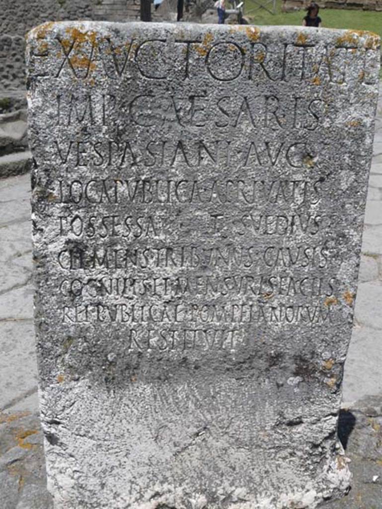 Pompeii Porta Nocera. May 2012. South side of Cippus of Titus Suedius Clemens.
Photo courtesy of Buzz Ferebee. The Cippus has the Latin inscription:
Ex auctoritate
imp(eratoris) Caesaris
Vespasiani Aug(usti)
loca publica, a privatis
possessa T(itus) Suedius
Clemens tribunus causis
cognitis et mensuris factis
rei publicae Pompeianorum
restituit,
By virtue of authority conferred upon him by the Emperor Vespasian Caesar Augustus,
Titus Suedius Clemens, tribune, having investigated the facts and taken measurements,
restored to the citizens of Pompeii public places illegally appropriated by private persons.
Similar Cippi were found at the Porta Ercolano, Porta Marina and the Porta Vesuvio.
The wording “rei publicae Pompeianorum” on one of these, discovered in 1763, was the first positive identification that the site was Pompeii.
Until then scholars had divided opinions on the city buried under Cività.
Many, including the first official excavators, thought it was the ancient city of Stabiae.
See Conticello, B., Ed, 1990. Rediscovering Pompeii. Rome: L’Erma di Bretschneider. (p. 225).