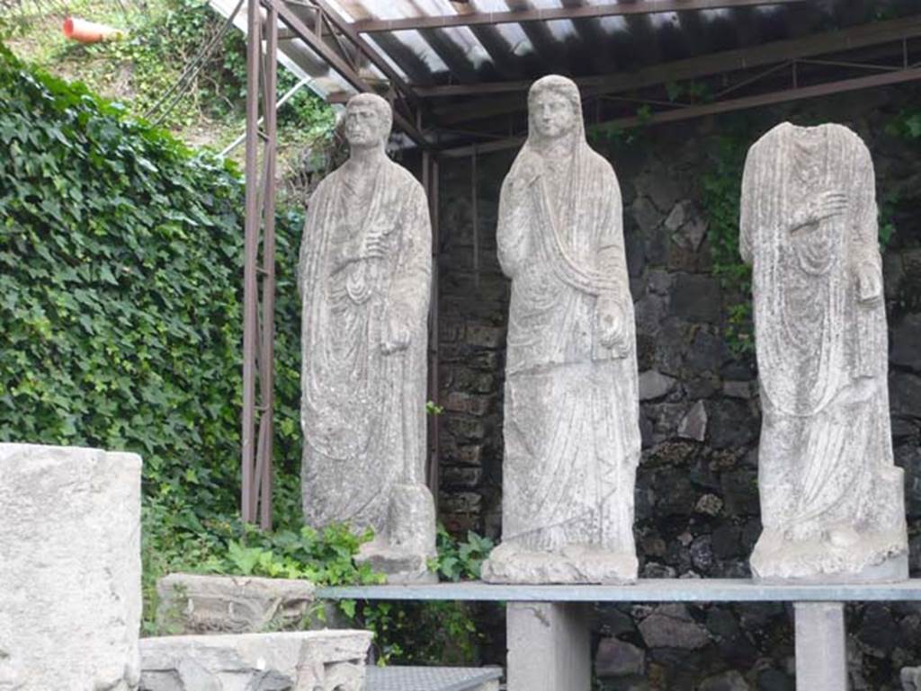 Pompeii Porta Nocera. May 2011. South side of the Via delle Tombe between tombs OS and ES.
Three statues from tomb 34aEN, now in display area for items found in and near the tombs.
Photo courtesy of Buzz Ferebee.