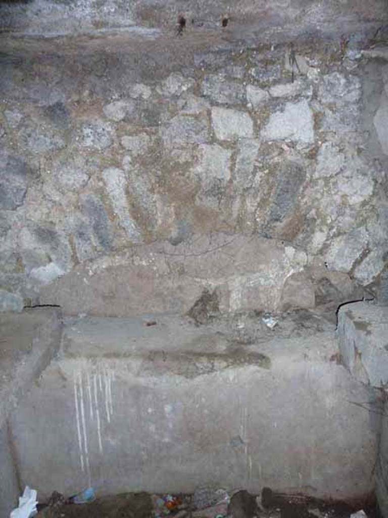 Pompeii Porta Nocera. May 2010. Tomb 7OS. Room on west side of entrance corridor. Niche on west wall.
In the tomb arch on the west side were three cinerary urns.
The central one was inscribed in carbon, in Greek, AGATHEA FLAVIA.
On the urn on the left was written in Latin ACASTUS.
On the urn on the left was a inscription that had vanished apart from an A.
See D’Ambrosio, A. and De Caro, S., 1983. Un Impegno per Pompei: Fotopiano e documentazione della Necropoli di Porta Nocera. Milano: Touring Club Italiano. (7OS)