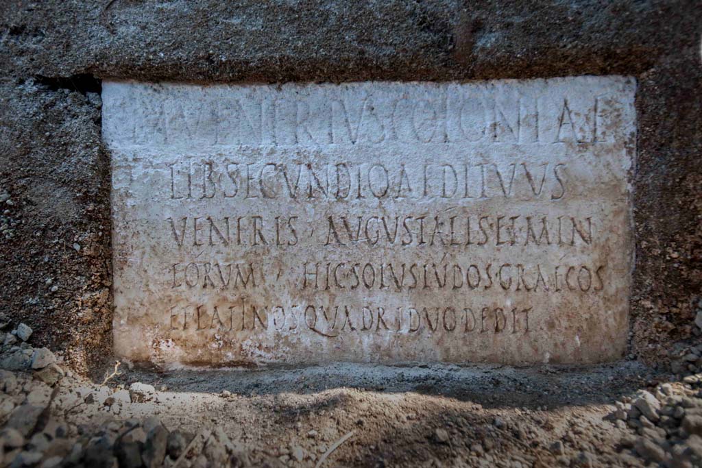 Porta Sarno la tomba di Marcus Venerius Secundio. August 2021.
On a marble slab located on the pediment of the tomb, a commemorative inscription to the owner Marcus Venerius Secundio makes reference, extraordinarily, to performances at Pompeii that were conducted in Greek, direct evidence of which has never before been found.
The figure of Marcus Venerius Secundio - who also appears in the wax tablet archive of the Pompeian banker Caecilius Giocondo, owner of the domus of the same name on Via Vesuvio - was a public slave and custodian of the Temple of Venus. Upon being freed, he reached a certain social and economic status, as can be understood from the rather monumental tomb, and the inscription: in addition to joining the ranks of the Augustales, or the college of priests dedicated to the Imperial Cult, as the epigraph recalls he "gave Greek and Latin ludi for the duration of four days". "Ludi graeci are to be understood as performances in the Greek language': - observes the Director of the Archaeological Park of Pompeii, Gabriel Zuchtriegel.
Sulla lastra marmorea posta sul frontone della tomba un'iscrizione commemorativa del proprietario Marcus Venerius Secundio richiama, straordinariamente, lo svolgimento a Pompei di spettacoli in lingua greca, mai prima attestati in maniera diretta.
Il personaggio di Marcus Venerius Secundio - che compare anche nell'archivio di tavolette cerate del banchiere pompeiano Cecilio Giocondo, proprietario della domus omonima su via Vesuvio – era uno schiavo pubblico e custode del tempio di Venere. Una volta liberato, aveva poi raggiunto un certo status sociale ed economico, come emergerebbe non solo dalla tomba piuttosto monumentale, ma anche dall'iscrizione: oltre a diventare Augustale, ovvero membro del collegio di sacerdoti dediti al culto imperiale, come ricorda l'epigrafe, "diede ludi greci e latini per la durata di quattro giorni". "Ludi graeci è da intendere come spettacoli in lingua greca - commenta il direttore del Parco archeologico di Pompei, Gabriel Zuchtriegel.
M VENERIVS COLONIAE
LIB SECUNDIO AEDITVVS
VENERIS AVGVSTALIS ET MIN
EORVM HIC SOLVS LVDOS GRAECOS
ET LATINOS QVADRIDVO DEDIT
Photograph © Parco Archeologico di Pompei.
According to Virginia Campbell the reads as:
M(arcus) Venerius coloniae
lib(ertus) Secundio, aedituus
Veneris, Augustalis et min(ister)
eorum. Hic solus ludos Graecos
et Latinos quadriduo dedit.
And translates as:
‘Marcus Venerius Secundio, freedmen of the colony, guardian of the temple of Venus, Augustalis and minister of them. He, on his own, gave Greek and Latin games for four days.
See https://pompeiinetworks.wordpress.com/2021/08/19/the-tomb-of-marcus-venerius-secundio/
