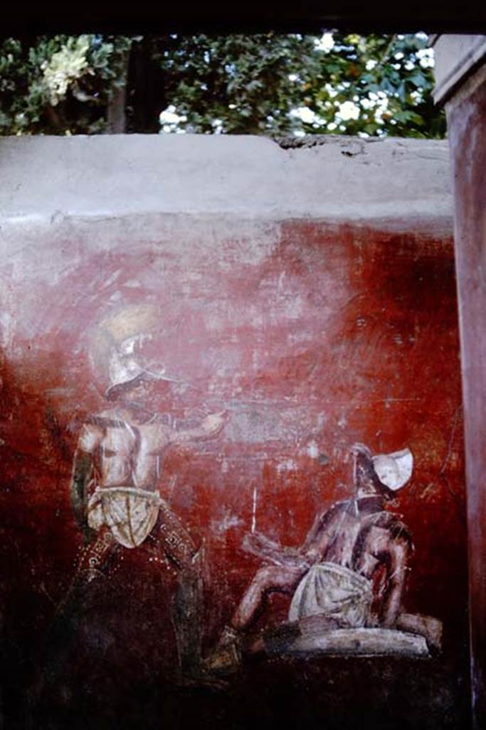 VGJ Pompeii. 1964. Inner side of west wall of tomb with entrance door on right. Painting of a gladiator fight hosted by or held in honour of the deceased. Photo by Stanley A. Jashemski.
Source: The Wilhelmina and Stanley A. Jashemski archive in the University of Maryland Library, Special Collections (See collection page) and made available under the Creative Commons Attribution-Non Commercial License v.4. See Licence and use details.
J64f1623