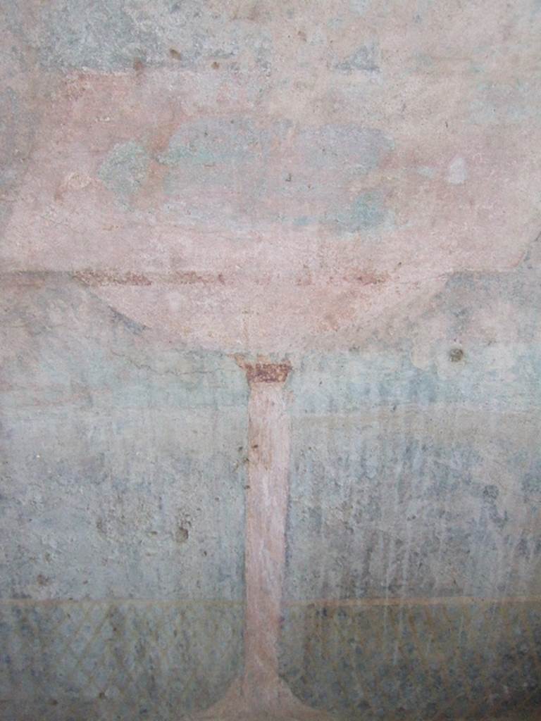 VGJ Pompeii. May 2006. Inner side of east wall of tomb. Garden painting with low lattice fence. A bowl fountain with a square brim stands in front of the fence and is supported by a tall slender pedestal.