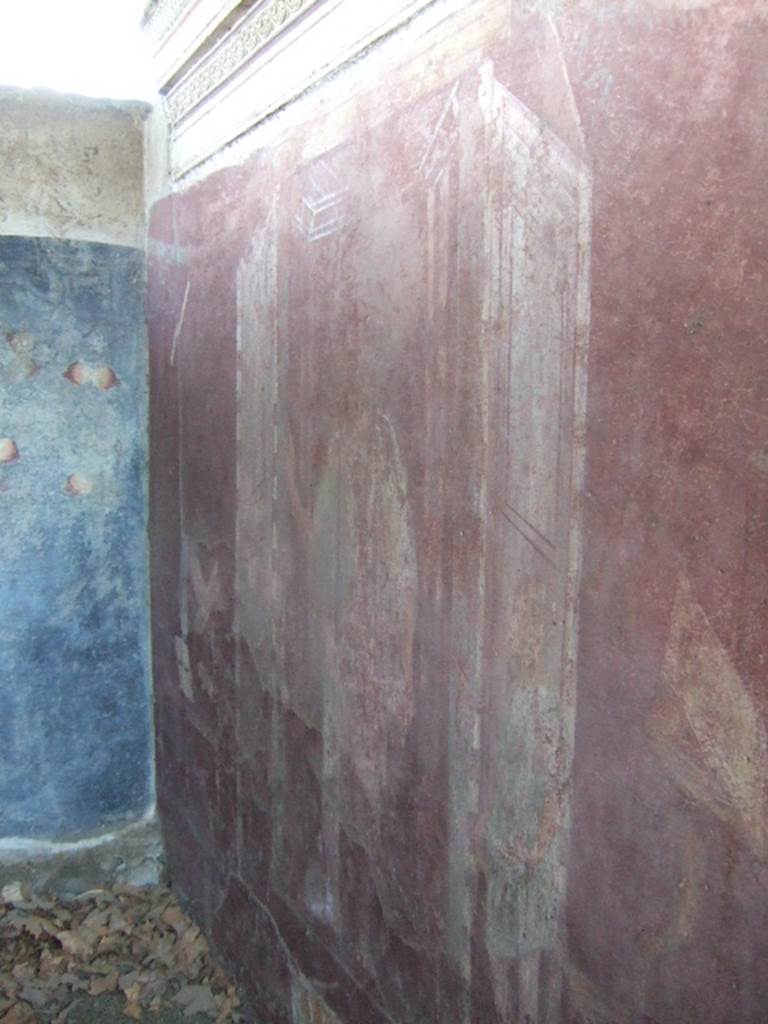 VGJ Pompeii. May 2006. West wall of inner tomb. Painting of Vestorius Priscus entering a room which has writing implements and money on a table, and a couch. See Cooley, A. and M.G.L., 2004. Pompeii : A Sourcebook. London : Routledge. (F88, p.128).