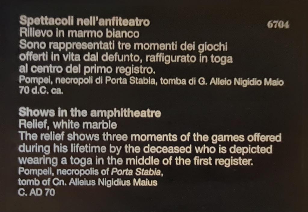 SG7 Pompeii. April 2023. Descriptive card in Naples Archaeological Museum. This clearly attributes this relief to the tomb of Gnaeus Alleius Nigidius Maius, tomb SG6.
Photo courtesy of Giuseppe Ciaramella.