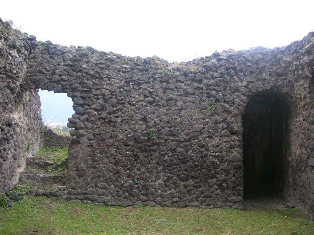Tower X, Pompeii. May 2010. Looking towards south wall on first floor.
The steps, on the left, would have led to the upper floor. The doorway, on the right, leads to steps to the lower floor.
Photo courtesy of Ivo van der Graaff.
