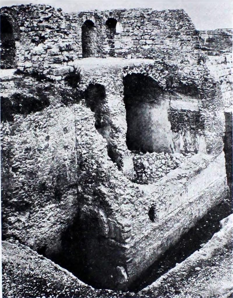 Tower XI Pompeii. Pre 1944. Looking south-west towards north side of Tower.
This is shown in NdS (as below) as being from Tower XI and is shown very similar to Tower XII in its current state of preservation.
According to NdS –
Un restauro parziale, suggerito dall’opportunità di giovarsi di una delle torri per avere una veduta panoramica delle rovine, venne precedentemente eseguito della Torre XI, più comunemente nota con il nome di Torre della Via di Mercurio: il restauro si limitò al secondo ripiano della torre. La fotografia a fig. 13 mostra quale fosse lo stato di conservazione delle strutture esterne ed interne prima della ripresa della cortina murarie e delle volte.
(A partial restoration, suggested by the opportunity to take advantage of one of the towers to give a panoramic view of the ruins, was previously carried out on Tower XI, more commonly known as the Tower of the Via di Mercurio: the restoration was limited to the second level of the tower. The photograph in fig. 13 shows the state of conservation of the external and internal structures before the restoration of the curtain wall and the vaults.)
See Notizie degli Scavi di Antichità, 1944-45, (fig. 13, p. 293)