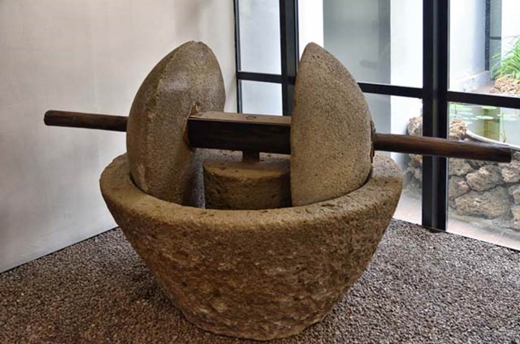 Villa della Pisanella, Boscoreale. April 2018. Oil mill (trapetum) consisting of a frustoconical tub (catillus) and by two wheels of a spherical cap (orbes).
Now in Boscoreale Antiquarium. Photo courtesy of Ian Lycett-King.
Use is subject to Creative Commons Attribution-NonCommercial License v.4 International.