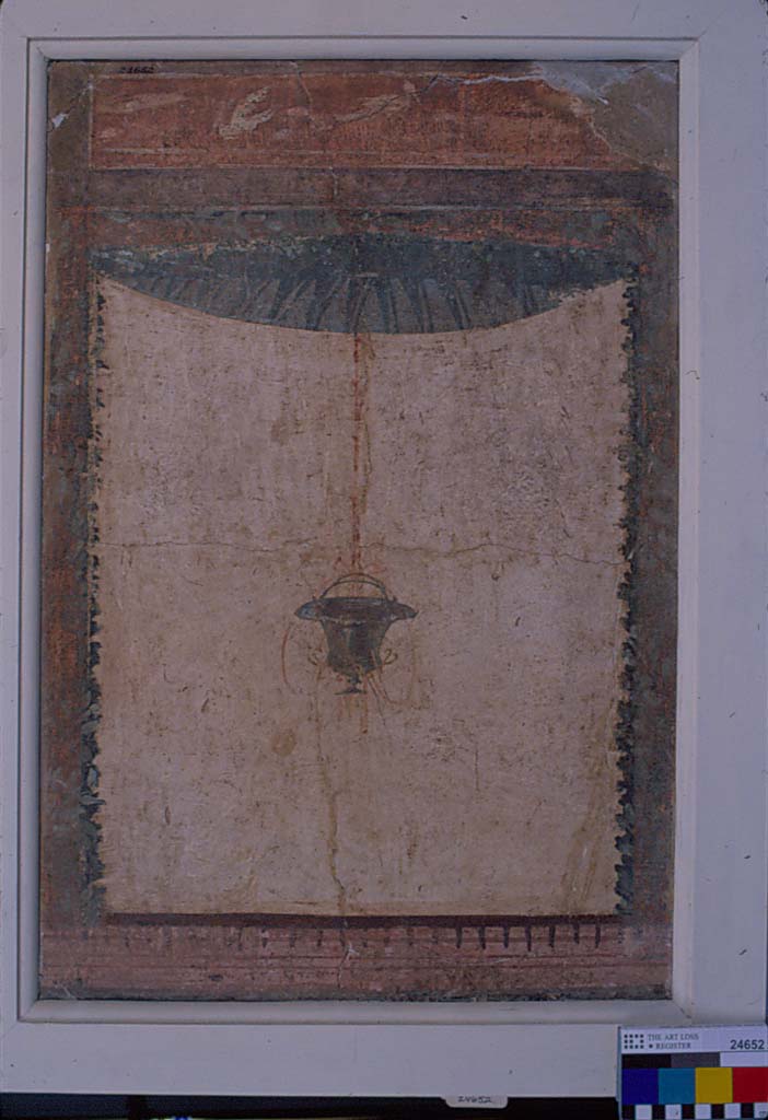 Villa della Pisanella, Boscoreale. Fresco fragment. Decorative compartment with border and top piece.
Compartment is a room enclosed by a four sided frame or border.
Suspended vase in middle. Rosette and leaves partially visible. Birds in top panel.
According to De Cou, this is 24655.
The suspended vase is like that of the other fresco (No. 24652), but the details are more clearly preserved.
In the interior of the top-piece the base-line is visible, but of the figures only indistinct blotches remain.
One of these (on the left side) may have been a horse, the others are small and shapeless.
From the close resemblance existing between this piece and No. 24652 it is very probable that they are corresponding pieces from the same wall.
See De Cou F. Antiquities from Boscoreale in Field Museum Of Natural History (January 1, 1912), p. 165, pl. CXXIII.
Photo © Field Museum of Natural History - CC BY-NC.
Now in the Field Museum, where it is shown as 24655 See in Field Museum and as part of inventory number 24652 See in Field Museum.