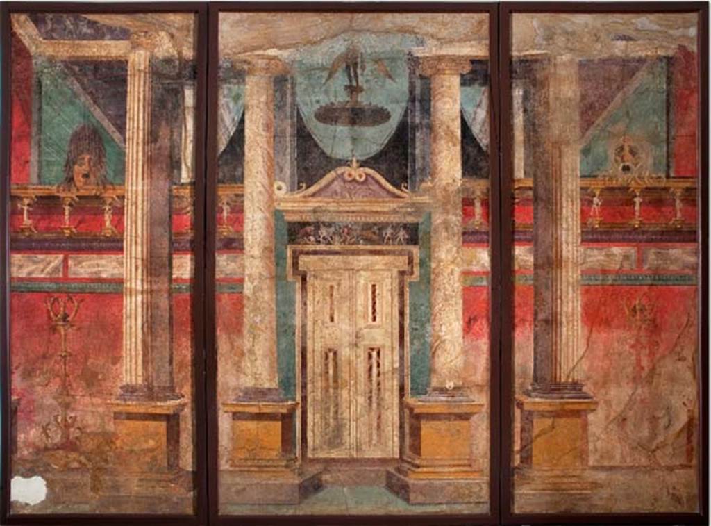 Villa of P. Fannius Synistor at Boscoreale. Room G, summer triclinium, west wall. Architectural scene with large portico decorated with Corinthian columns, pilasters and a set of imitation doors. There are two candelabra in front of the wall, each with figures of Victory at the top and cupids at the bottom. The cornice of the wall is supported by Satyrs and Maenads. On top of the wall stand two tragic masks. At the top of the door is a frieze with a hunting scene, reminiscent of Artemis. A winged Eros flies above the door. Now in Naples Archaeological Museum. Inventory number s.n. 1. See Schefold, K., 1962. Vergessenes Pompeji. Bern: Francke. p. 33.