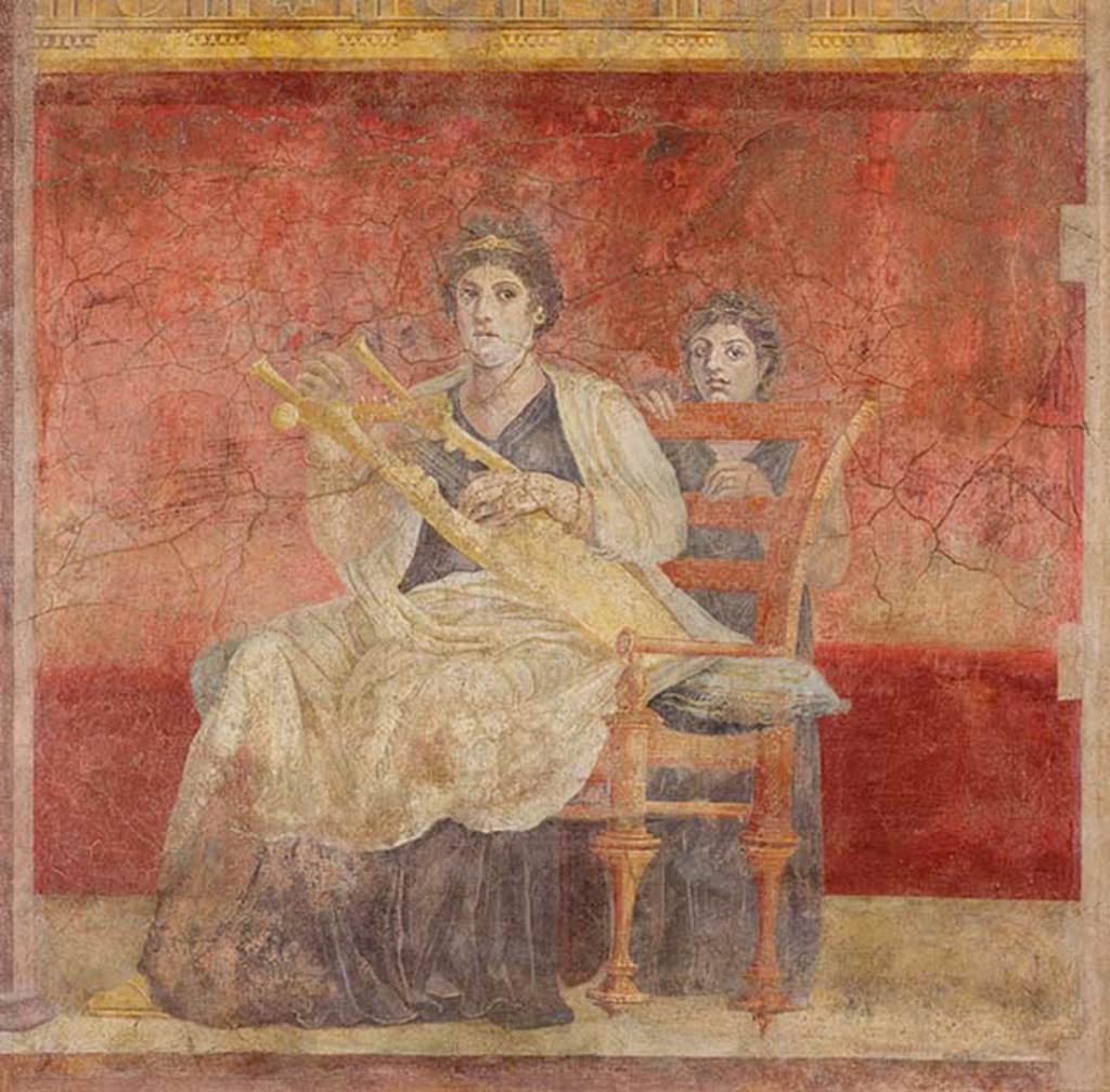 Villa of P Fannius Synistor at Boscoreale. Room H, triclinium or oecus, panel at north end of east wall.
A seated woman in white and purple garments is playing a golden kithara.
She and the young girl standing behind her chair looking towards the spectator or the entrance.
Photo © The Metropolitan Museum of Art, Rogers Fund 1903. Inventory number 03.14.5.
See www.metmuseum.org
On the east wall were three paintings.
At the left end was a seated woman wearing purple and white robes, playing a golden lyre.
At the rear was another female figure, a young girl standing behind the chair.
In the central panel, a couple in conversation on a throne were painted.
The woman leaning forward with her chin on her fist, gazing at the nude male figure at her side, whose crossed hands rested on a golden staff.
At the right end, was a female painted standing, turning her head upwards to gaze towards the wall with Venus.
In her right hand, she held a shield which showed the reflection of a nude youth, also gazing towards the north wall and Venus.