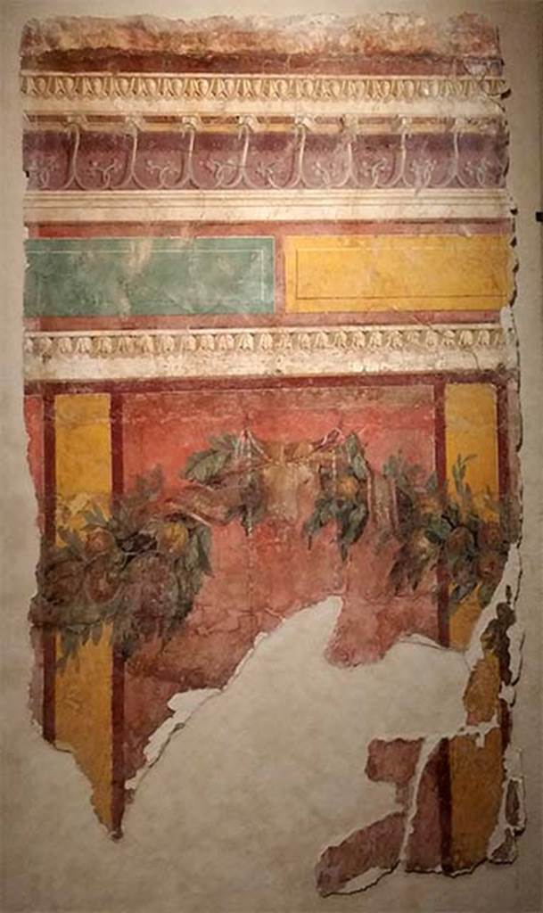 Villa of P. Fannius Synistor at Boscoreale. Room L, tablinum, east wall.
Panel with garland, bucranium, red panels with yellow dividing bars, yellow and green blocks with cornice above.
Now in the Musée de Picardie, Amiens, France.
See http://amiens.fr/votre_vie_quotidienne/vie_culturelle/musees_damiens/musee_de_picardie.html