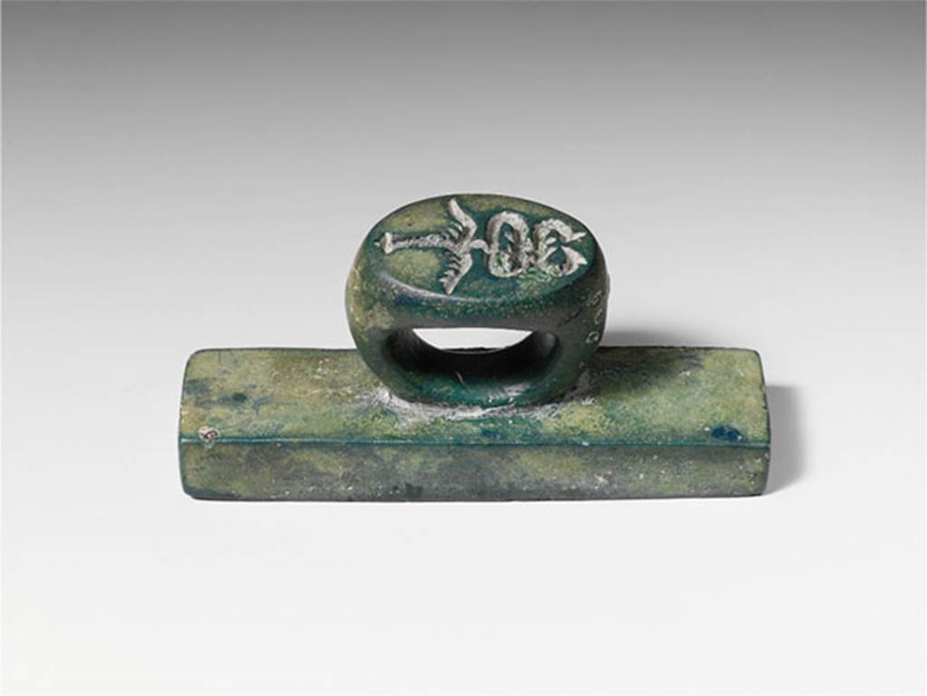 Villa of P Fannius Synistor at Boscoreale. Bronze seal and stamp engraved L. HER. FLO. According to the Metropolitan Museum New York, on the ring in intaglio (carved) is a second seal in the form of a winged caduceus, the staff of Mercury, god of commerce. Many such bronze seals have been found in the excavations at the nearby towns of Pompeii and Herculaneum, although stamps with intaglio on both ring and plate are less common.
Photo © The Metropolitan Museum of Art, Fletcher Fund 1930. See www.metmuseum.org
